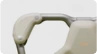 A close-up of a softly curved cream and brushed metal product